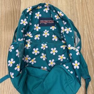 Jansport Teal Backpack with Daisy Pattern